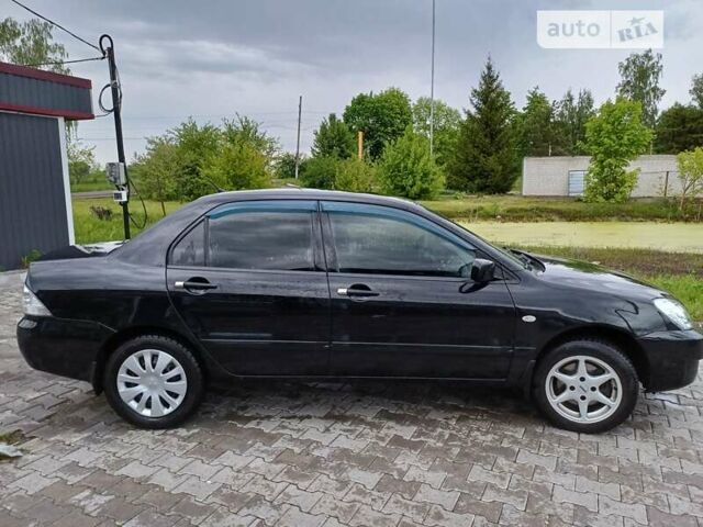 Чорний Міцубісі Lancer, об'ємом двигуна 1.6 л та пробігом 200 тис. км за 4900 $, фото 4 на Automoto.ua