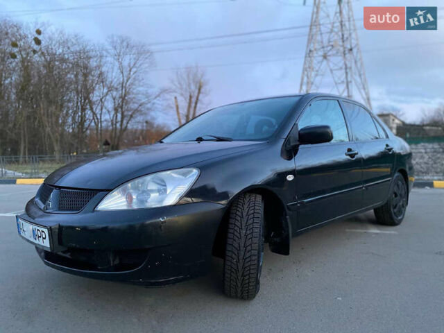 Чорний Міцубісі Lancer, об'ємом двигуна 1.58 л та пробігом 327 тис. км за 4000 $, фото 9 на Automoto.ua