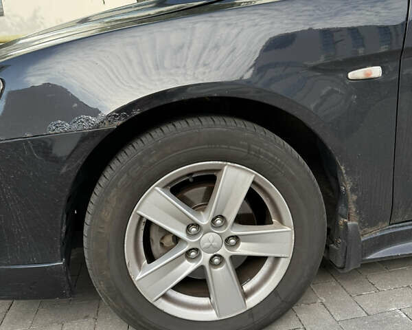 Чорний Міцубісі Lancer, об'ємом двигуна 2 л та пробігом 215 тис. км за 6700 $, фото 4 на Automoto.ua