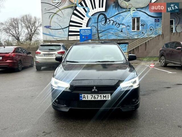 Черный Мицубиси Лансер, объемом двигателя 2 л и пробегом 217 тыс. км за 7000 $, фото 13 на Automoto.ua