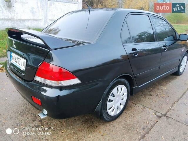 Мицубиси Лансер 2008 в Прилуках на Automoto.ua Черный Мицубиси Лансер, объемом двигателя 1.58 л и пробегом 219 тыс. км за 4900 $, фото 5 на Automoto.ua