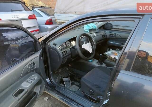 Черный Мицубиси Лансер, объемом двигателя 1.6 л и пробегом 200 тыс. км за 2000 $, фото 8 на Automoto.ua