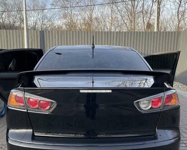 Чорний Міцубісі Lancer, об'ємом двигуна 2 л та пробігом 255 тис. км за 6999 $, фото 2 на Automoto.ua