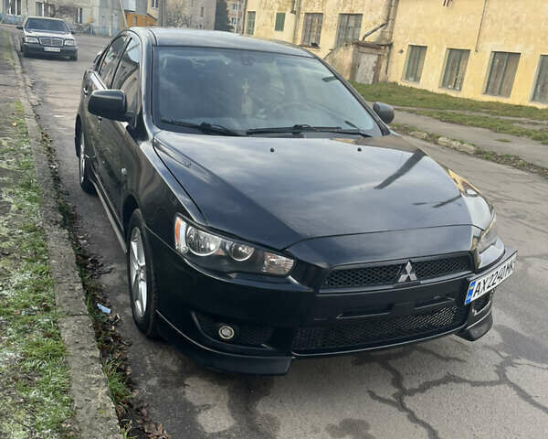 Черный Мицубиси Лансер, объемом двигателя 2 л и пробегом 270 тыс. км за 5400 $, фото 1 на Automoto.ua