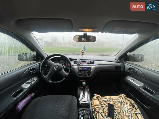 Черный Мицубиси Лансер, объемом двигателя 1.58 л и пробегом 211 тыс. км за 6333 $, фото 31 на Automoto.ua