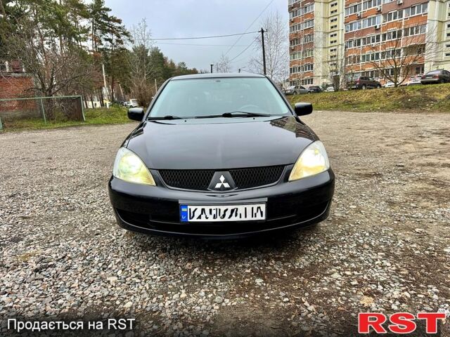 Черный Мицубиси Лансер, объемом двигателя 1.6 л и пробегом 216 тыс. км за 5190 $, фото 7 на Automoto.ua