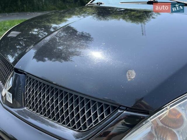 Чорний Міцубісі Lancer, об'ємом двигуна 1.6 л та пробігом 296 тис. км за 4200 $, фото 14 на Automoto.ua