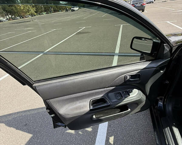 Черный Мицубиси Лансер, объемом двигателя 1.6 л и пробегом 321 тыс. км за 5000 $, фото 30 на Automoto.ua