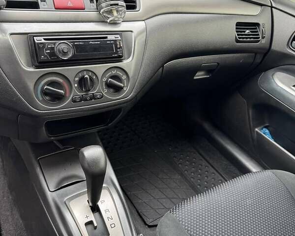 Чорний Міцубісі Lancer, об'ємом двигуна 1.6 л та пробігом 245 тис. км за 4500 $, фото 15 на Automoto.ua