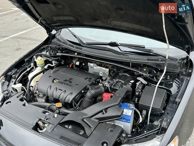 Чорний Міцубісі Lancer, об'ємом двигуна 2 л та пробігом 199 тис. км за 7900 $, фото 46 на Automoto.ua