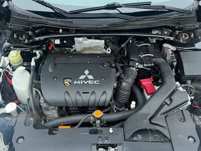 Черный Мицубиси Лансер, объемом двигателя 2 л и пробегом 185 тыс. км за 6100 $, фото 2 на Automoto.ua