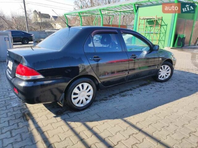 Чорний Міцубісі Lancer, об'ємом двигуна 1.6 л та пробігом 335 тис. км за 3100 $, фото 6 на Automoto.ua