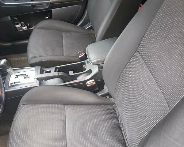 Черный Мицубиси Лансер, объемом двигателя 2 л и пробегом 192 тыс. км за 6350 $, фото 16 на Automoto.ua