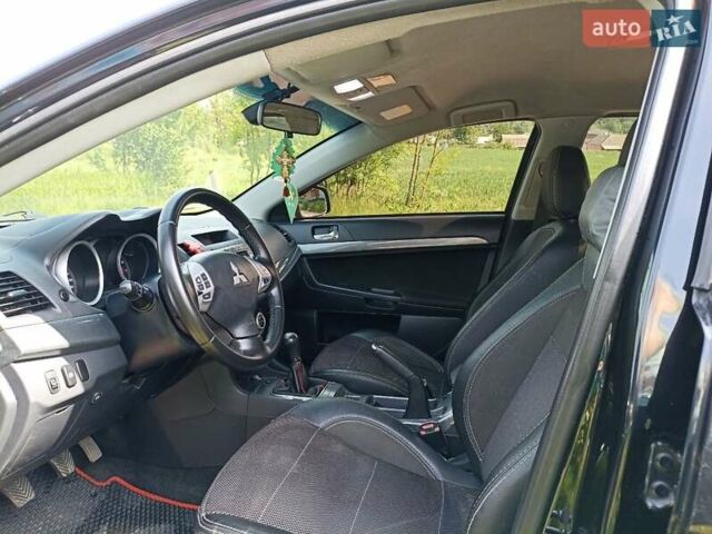 Черный Мицубиси Лансер, объемом двигателя 2 л и пробегом 214 тыс. км за 6300 $, фото 5 на Automoto.ua