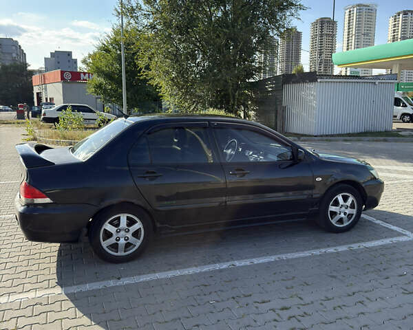 Черный Мицубиси Лансер, объемом двигателя 1.58 л и пробегом 364 тыс. км за 3000 $, фото 9 на Automoto.ua