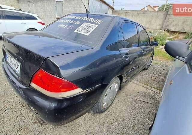 Черный Мицубиси Лансер, объемом двигателя 1.58 л и пробегом 316 тыс. км за 2200 $, фото 7 на Automoto.ua