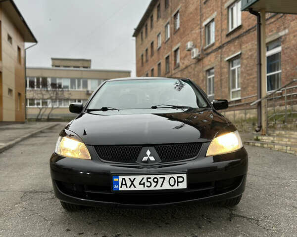 Чорний Міцубісі Lancer, об'ємом двигуна 1.58 л та пробігом 167 тис. км за 4800 $, фото 8 на Automoto.ua