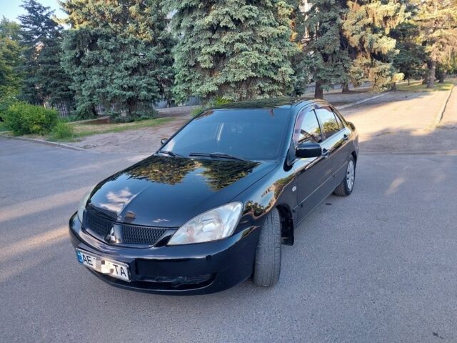 Чорний Міцубісі Lancer, об'ємом двигуна 1.6 л та пробігом 216 тис. км за 4500 $, фото 1 на Automoto.ua