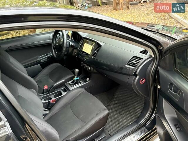 Черный Мицубиси Лансер, объемом двигателя 2 л и пробегом 260 тыс. км за 6100 $, фото 14 на Automoto.ua