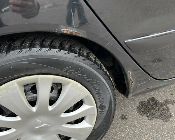 Чорний Міцубісі Lancer, об'ємом двигуна 1.58 л та пробігом 192 тис. км за 4500 $, фото 29 на Automoto.ua