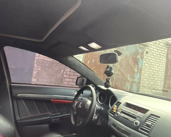 Черный Мицубиси Лансер, объемом двигателя 2 л и пробегом 275 тыс. км за 7700 $, фото 3 на Automoto.ua