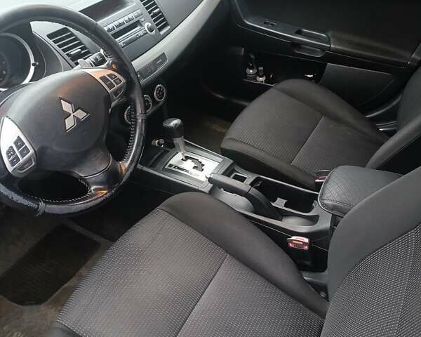 Черный Мицубиси Лансер, объемом двигателя 2 л и пробегом 192 тыс. км за 6350 $, фото 17 на Automoto.ua