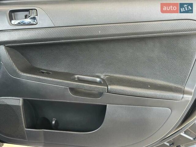 Чорний Міцубісі Lancer, об'ємом двигуна 2 л та пробігом 313 тис. км за 7690 $, фото 22 на Automoto.ua