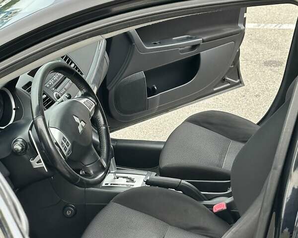 Чорний Міцубісі Lancer, об'ємом двигуна 2 л та пробігом 199 тис. км за 7900 $, фото 49 на Automoto.ua