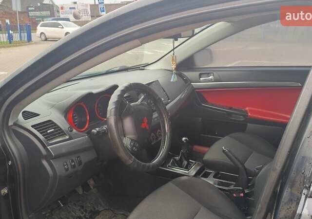 Чорний Міцубісі Lancer, об'ємом двигуна 2 л та пробігом 160 тис. км за 8000 $, фото 8 на Automoto.ua