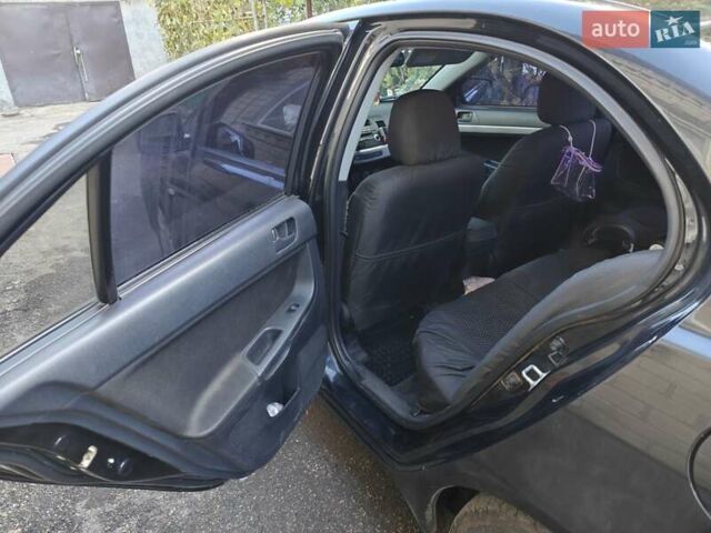 Мицубиси Лансер 2008 в Добровеличковке на Automoto.ua Черный Мицубиси Лансер, объемом двигателя 1.5 л и пробегом 175 тыс. км за 5500 $, фото 11 на Automoto.ua