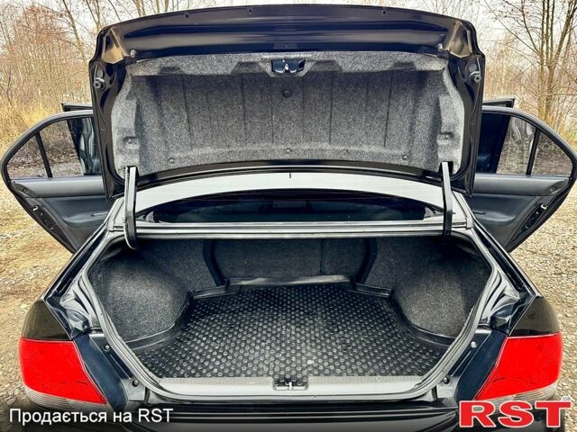 Черный Мицубиси Лансер, объемом двигателя 1.6 л и пробегом 216 тыс. км за 5190 $, фото 13 на Automoto.ua