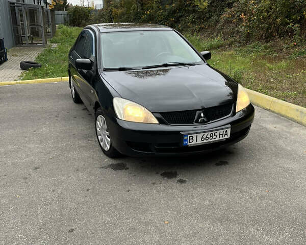 Чорний Міцубісі Lancer, об'ємом двигуна 1.58 л та пробігом 192 тис. км за 4500 $, фото 7 на Automoto.ua