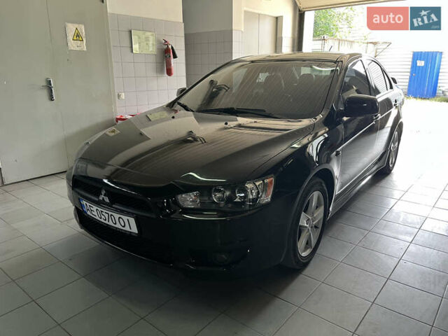 Черный Мицубиси Лансер, объемом двигателя 2 л и пробегом 200 тыс. км за 8000 $, фото 1 на Automoto.ua