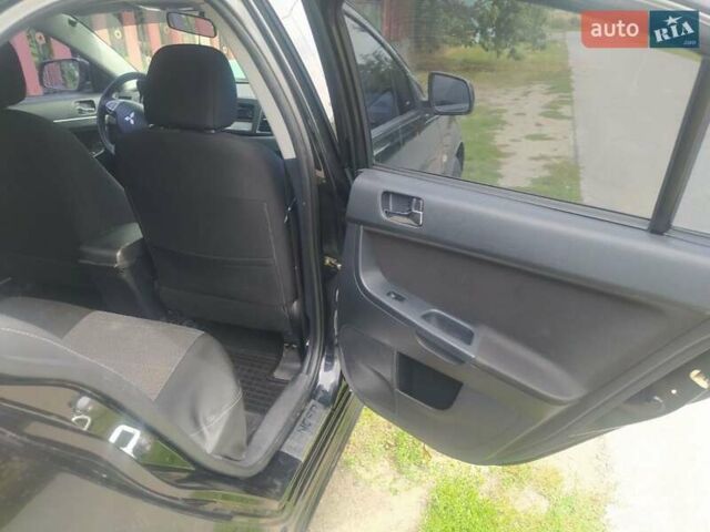 Чорний Міцубісі Lancer, об'ємом двигуна 2 л та пробігом 183 тис. км за 5000 $, фото 12 на Automoto.ua