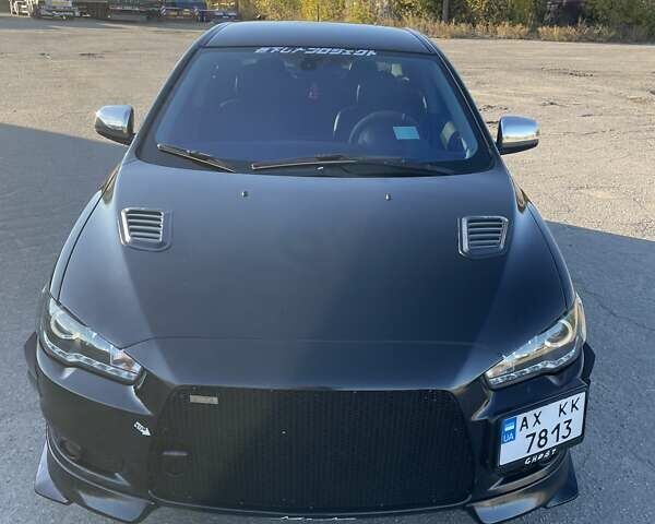 Чорний Міцубісі Lancer, об'ємом двигуна 2 л та пробігом 223 тис. км за 7800 $, фото 1 на Automoto.ua