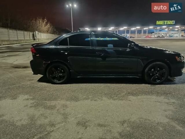 Черный Мицубиси Лансер, объемом двигателя 2 л и пробегом 240 тыс. км за 6400 $, фото 5 на Automoto.ua