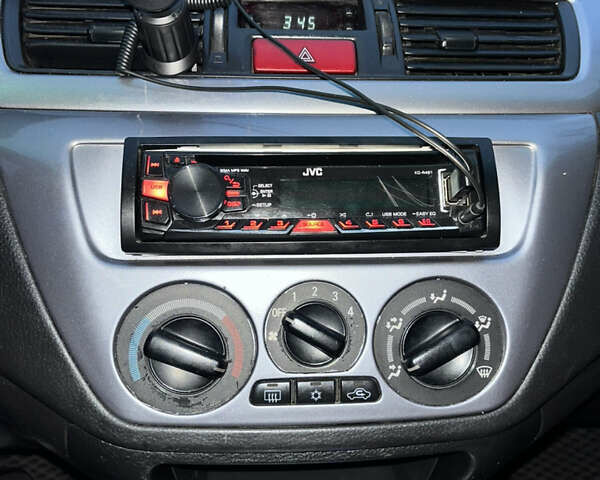 Чорний Міцубісі Lancer, об'ємом двигуна 1.6 л та пробігом 277 тис. км за 3900 $, фото 14 на Automoto.ua