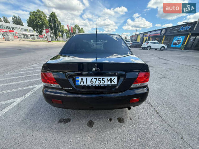 Чорний Міцубісі Lancer, об'ємом двигуна 1.6 л та пробігом 292 тис. км за 3600 $, фото 5 на Automoto.ua