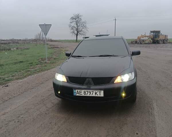 Чорний Міцубісі Lancer, об'ємом двигуна 1.58 л та пробігом 233 тис. км за 4800 $, фото 13 на Automoto.ua