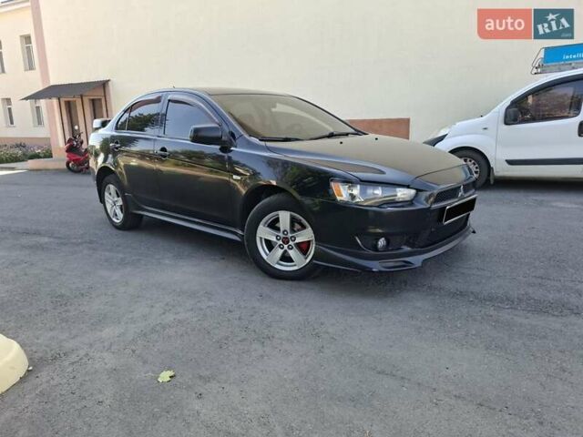 Черный Мицубиси Лансер, объемом двигателя 2 л и пробегом 230 тыс. км за 7000 $, фото 27 на Automoto.ua
