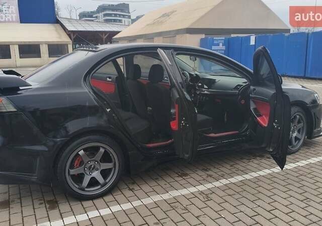 Чорний Міцубісі Lancer, об'ємом двигуна 2 л та пробігом 160 тис. км за 8000 $, фото 5 на Automoto.ua