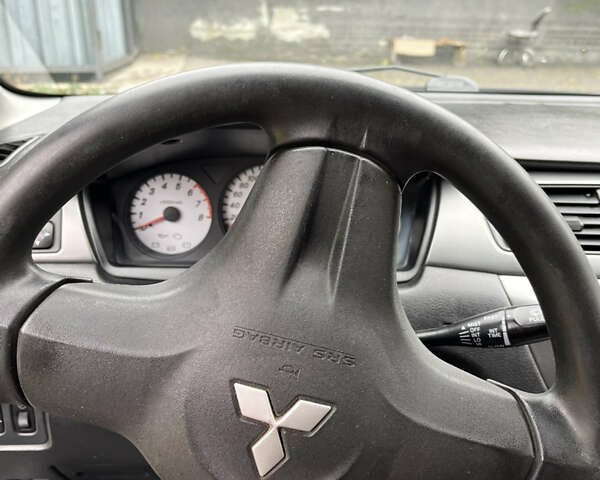 Чорний Міцубісі Lancer, об'ємом двигуна 1.58 л та пробігом 192 тис. км за 4500 $, фото 11 на Automoto.ua