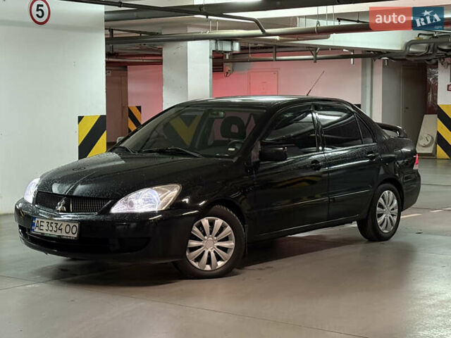 Чорний Міцубісі Lancer, об'ємом двигуна 1.58 л та пробігом 212 тис. км за 5500 $, фото 1 на Automoto.ua