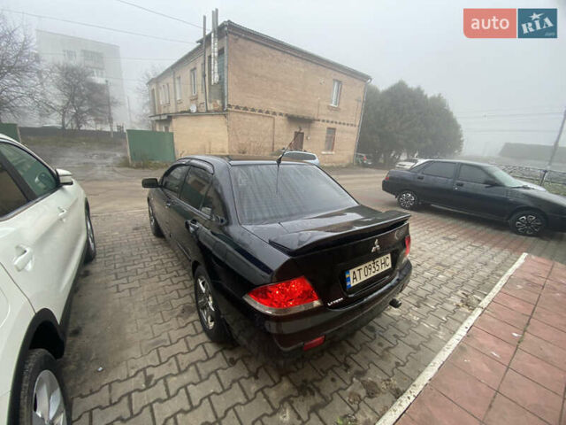 Черный Мицубиси Лансер, объемом двигателя 1.58 л и пробегом 211 тыс. км за 6333 $, фото 20 на Automoto.ua