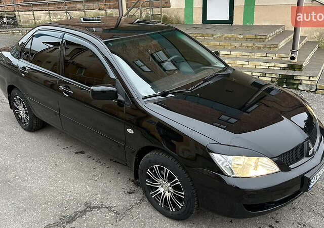 Чорний Міцубісі Lancer, об'ємом двигуна 1.58 л та пробігом 167 тис. км за 4800 $, фото 5 на Automoto.ua