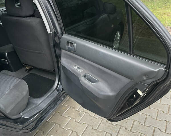 Черный Мицубиси Лансер, объемом двигателя 1.58 л и пробегом 214 тыс. км за 4400 $, фото 16 на Automoto.ua