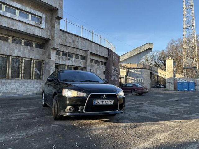 Черный Мицубиси Лансер, объемом двигателя 2 л и пробегом 236 тыс. км за 6550 $, фото 3 на Automoto.ua