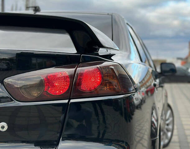 Черный Мицубиси Лансер, объемом двигателя 2 л и пробегом 236 тыс. км за 7950 $, фото 1 на Automoto.ua