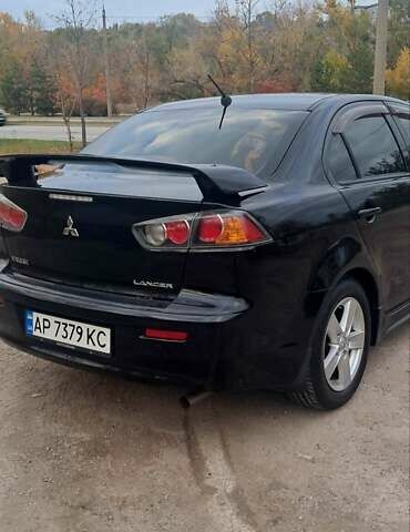 Черный Мицубиси Лансер, объемом двигателя 2 л и пробегом 211 тыс. км за 6900 $, фото 6 на Automoto.ua