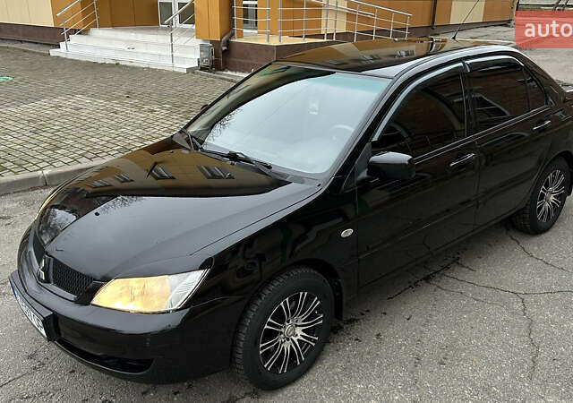Чорний Міцубісі Lancer, об'ємом двигуна 1.58 л та пробігом 167 тис. км за 4800 $, фото 7 на Automoto.ua